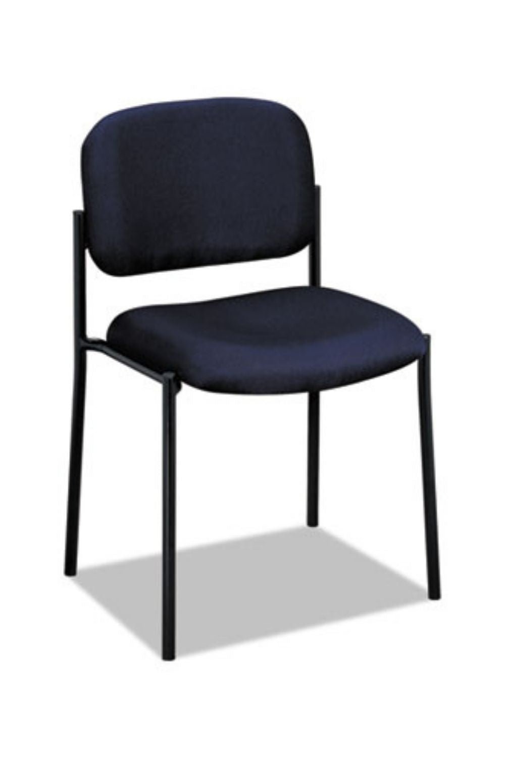 A person measures the height of an armless chair in a bright room.
