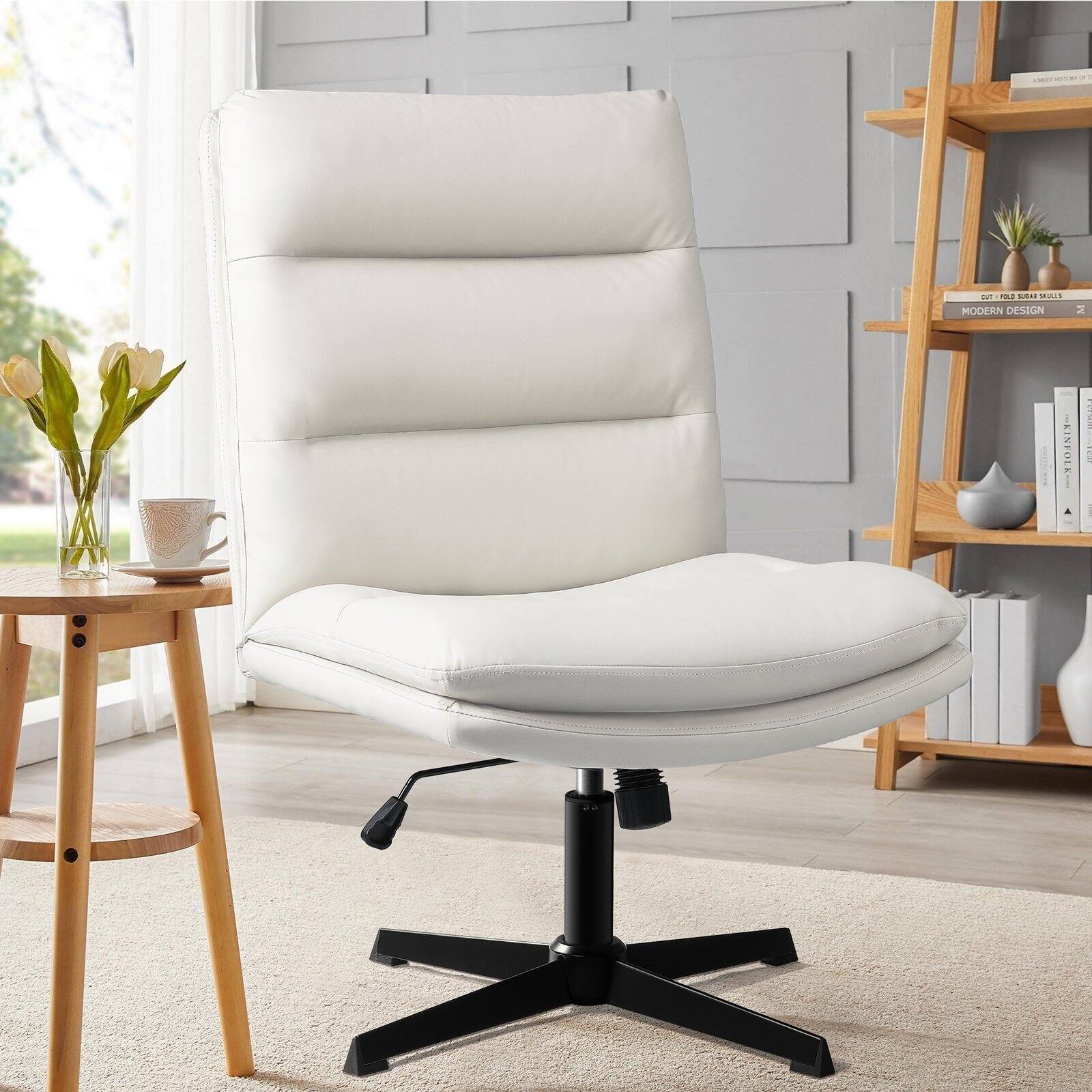 Two armless chairs arranged symmetrically in a bright, modern studio space.