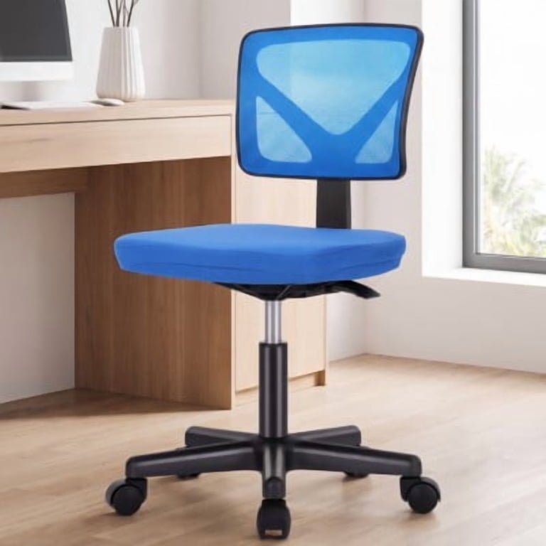 A person sitting in a comfortable ergonomic office chair at a clean workspace.