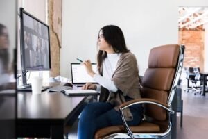 A modern ergonomic office chair displayed in a bright and minimalist home workspace.