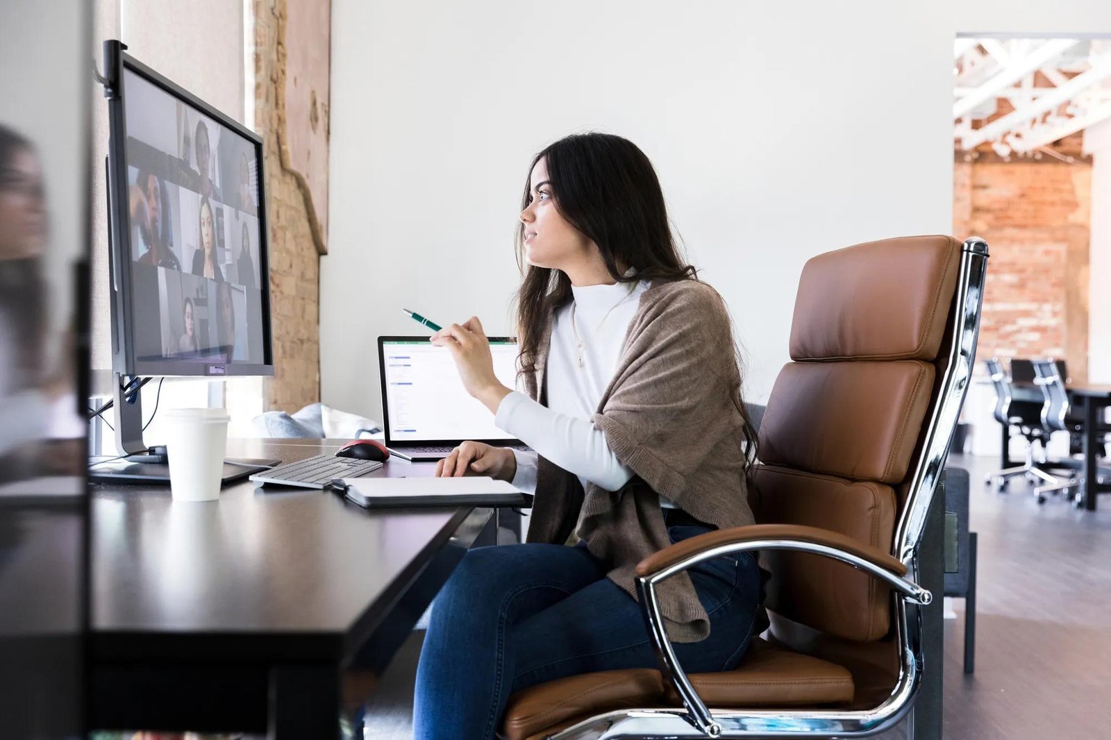 A modern ergonomic office chair displayed in a bright and minimalist home workspace.