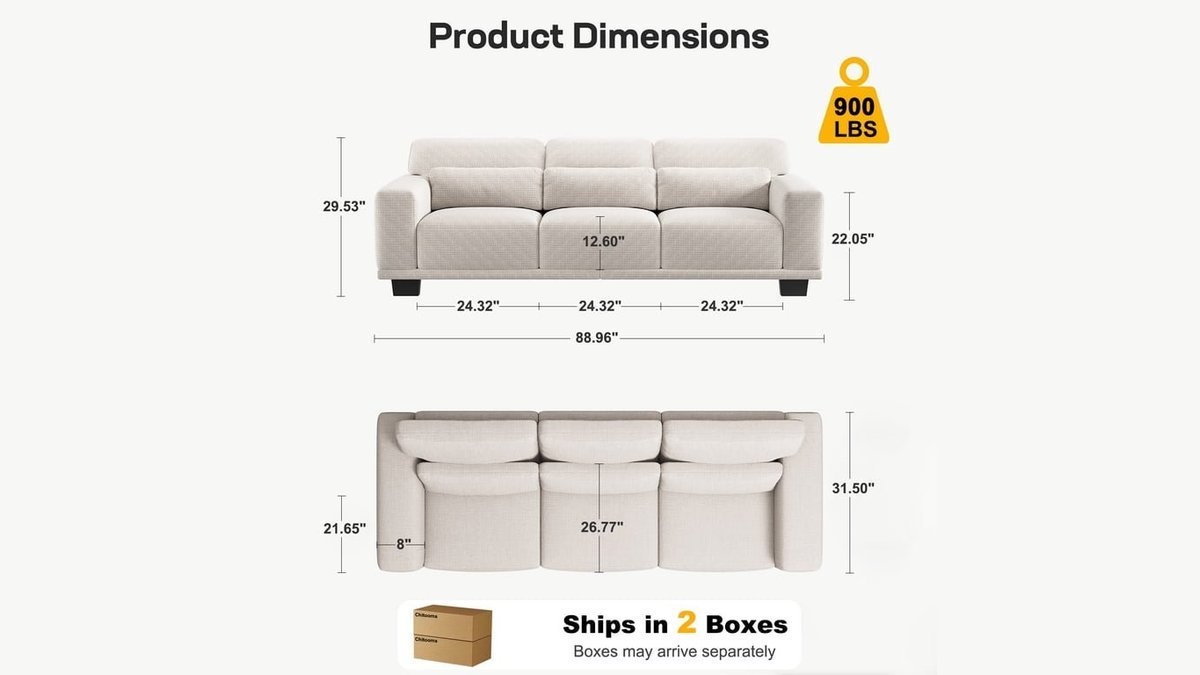 A modern three-seater sofa sits in a bright, minimalist living room setting.