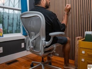 A modern ergonomic office chair in a bright and clean home office space.