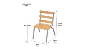 A modern wooden dining chair stands in a bright room to show typical chair dimensions.