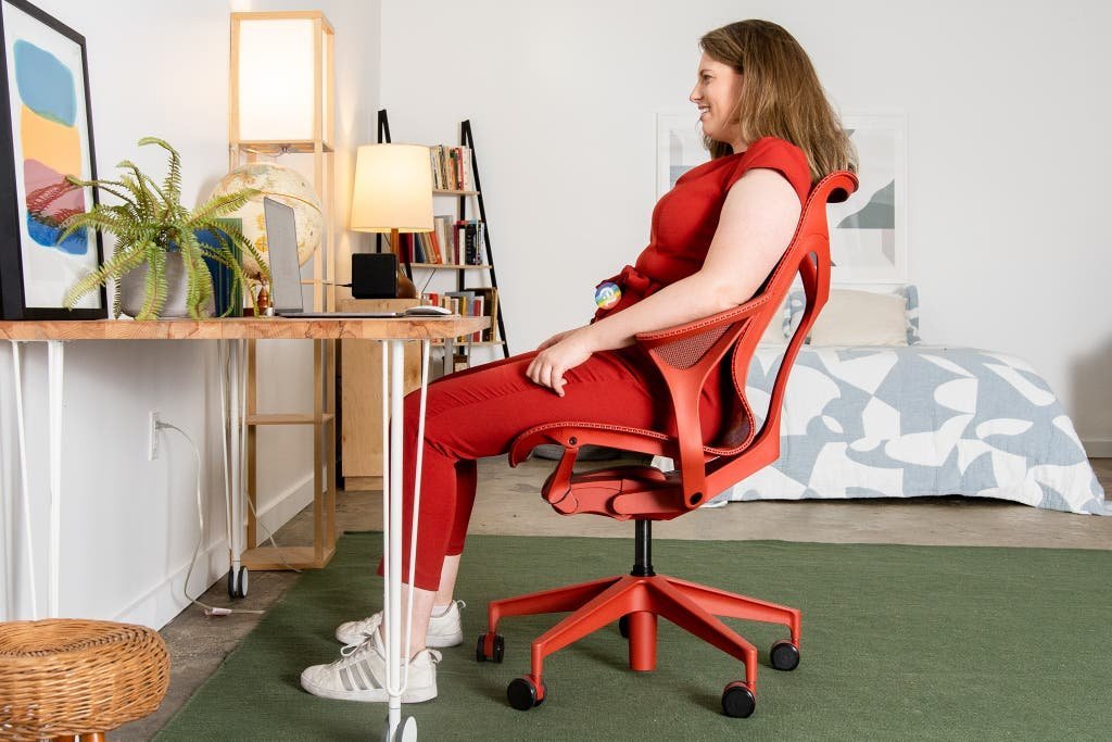 Two different ergonomic chairs showcasing options for various body heights in a home office.
