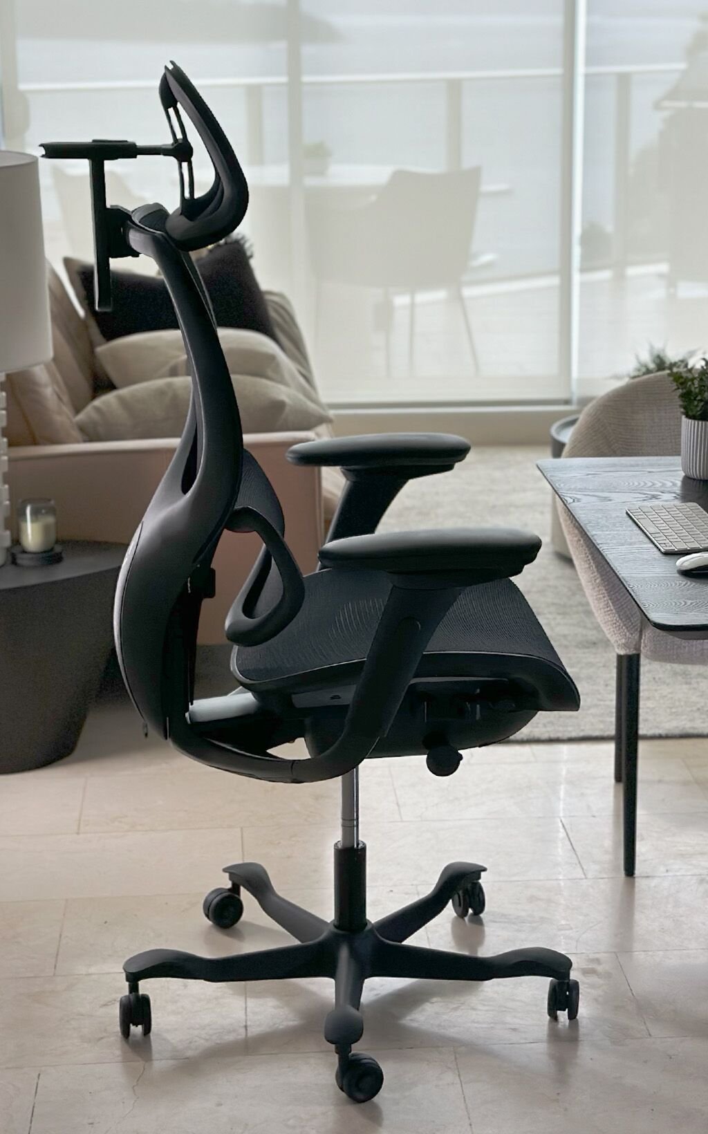 Various adjustment mechanisms on a modern ergonomic office chair for different body types.