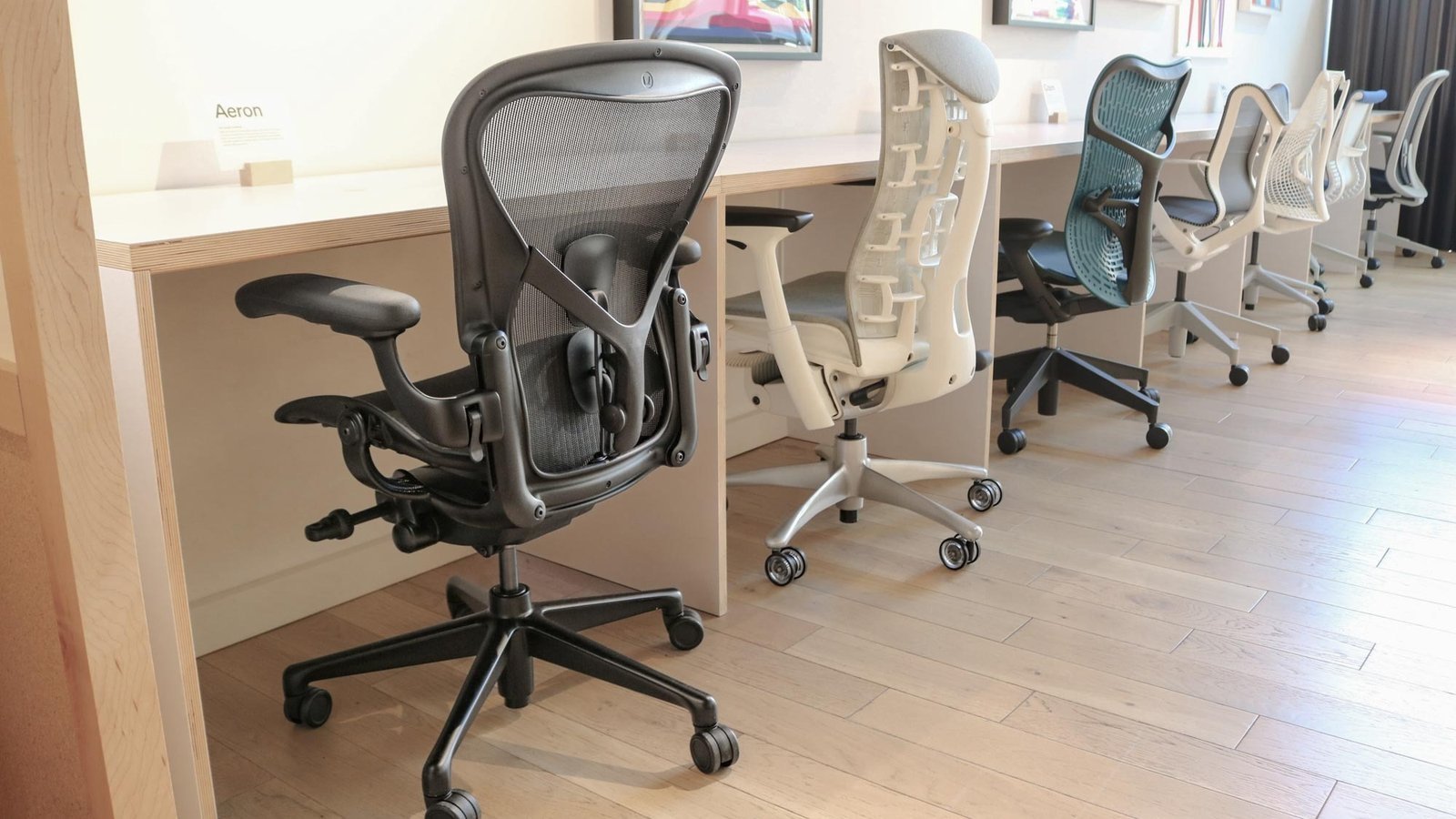 Close up of an office chair adjustment lever and size label in a showroom.