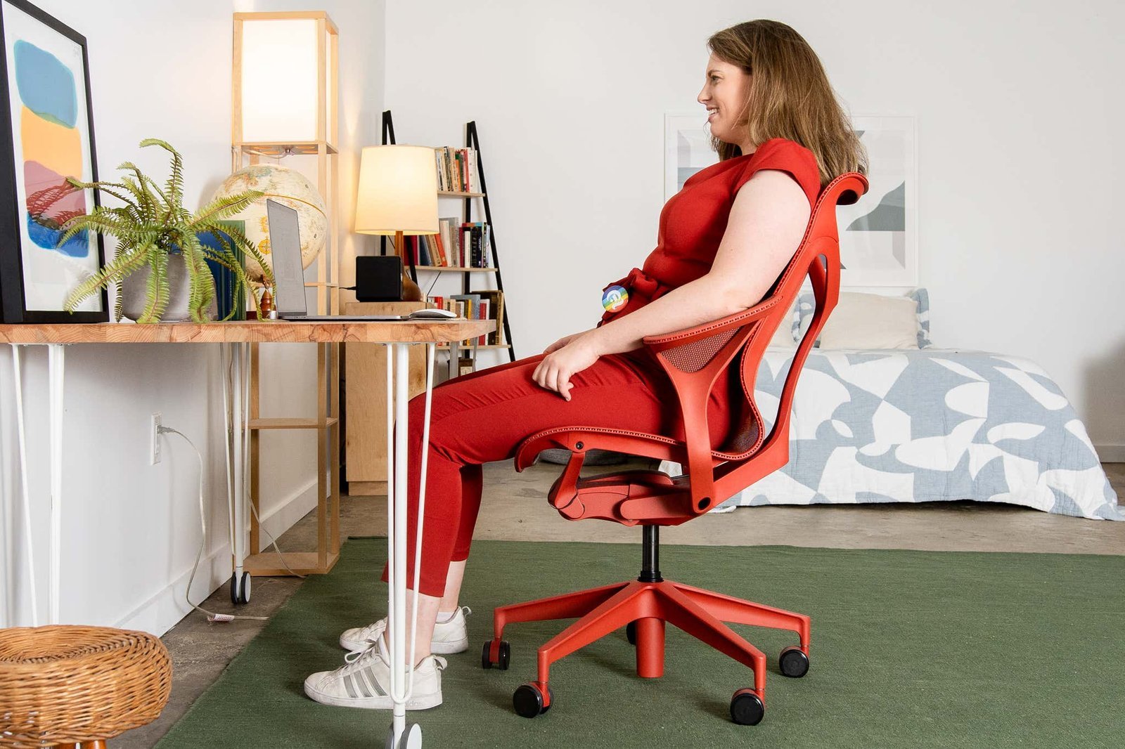 A modern ergonomic office chair displayed in a bright, clean, and professional workspace.