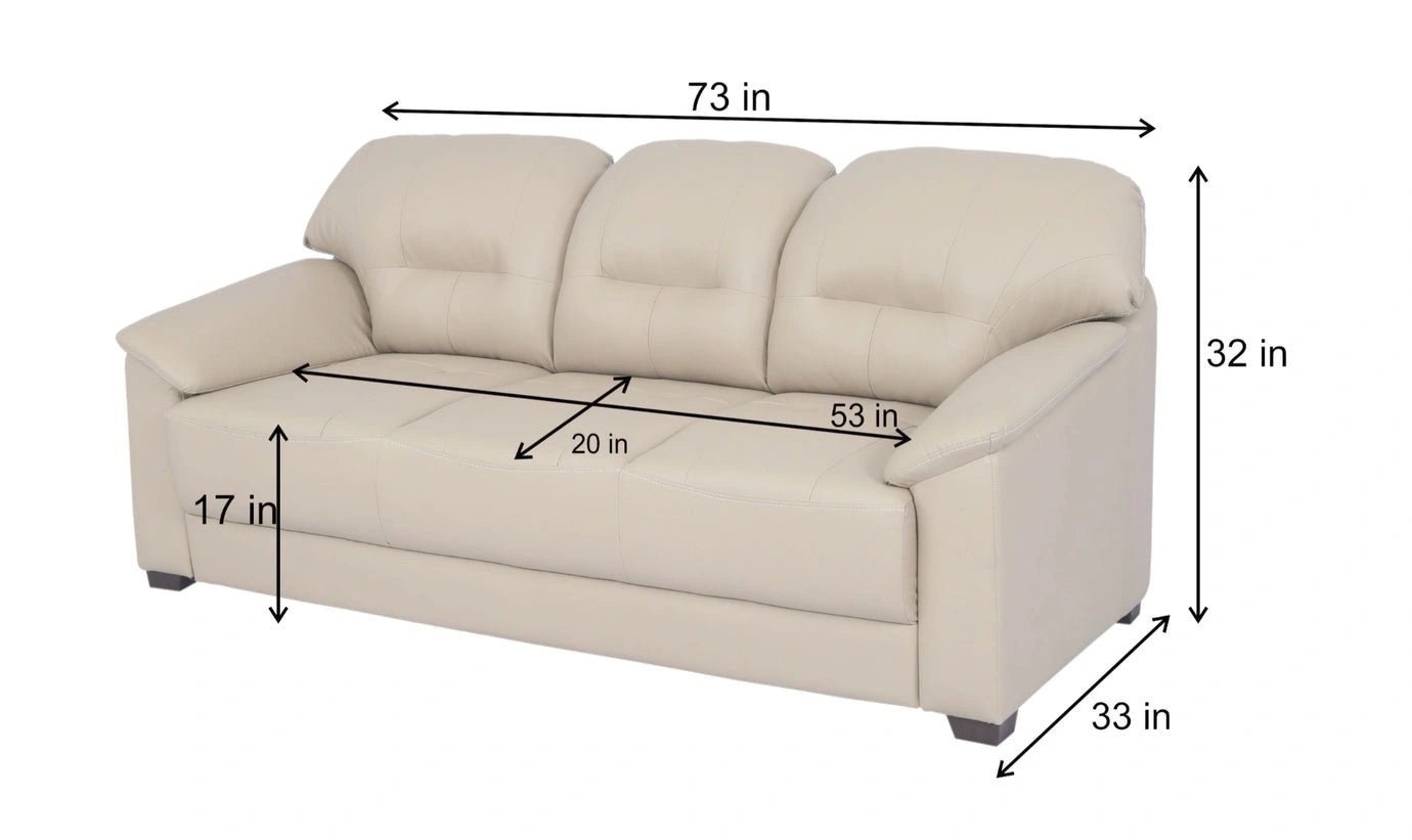 A perfectly sized sofa fills two-thirds of the wall, leaving space for a side table.