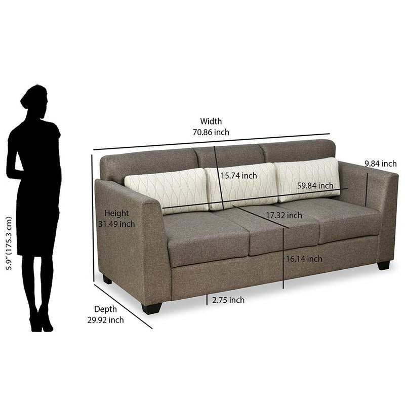 A person measuring a room with a tape measure to determine the correct sofa size.
