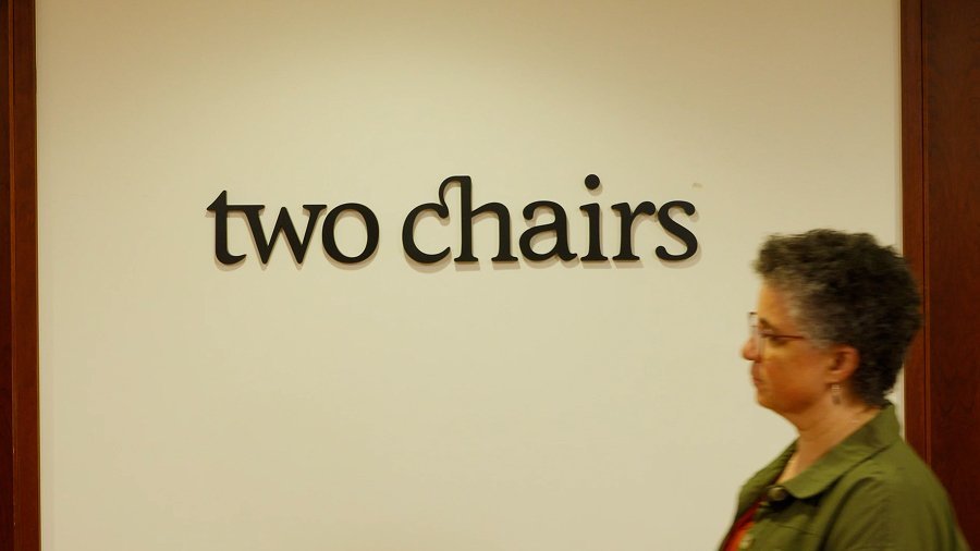 Close up of a person holding their arms to represent body awareness during therapy.