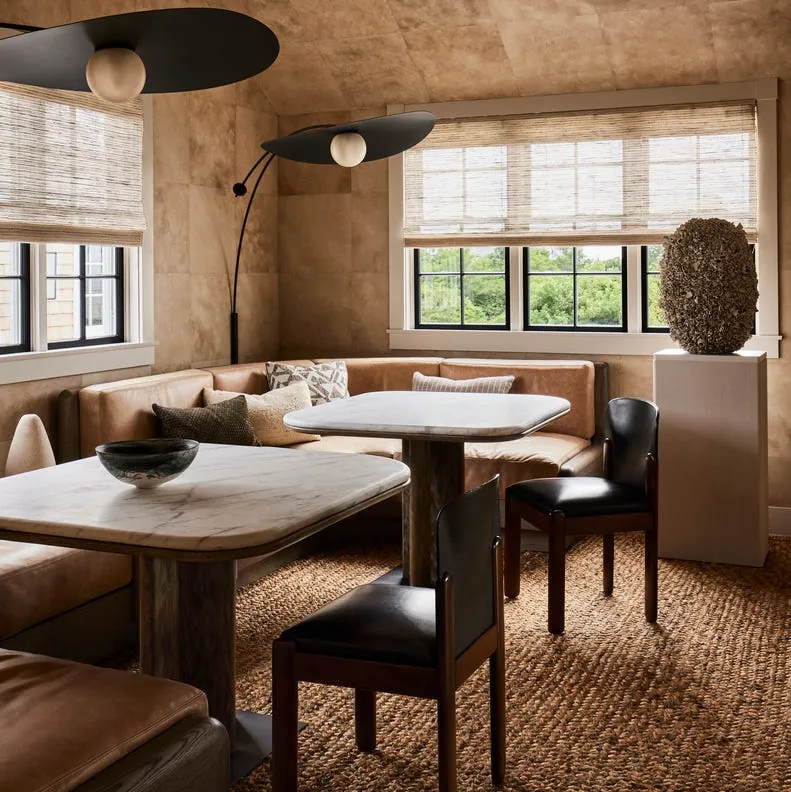 Alternative seating methods like floor cushions provide extra space for guests in small rooms.
