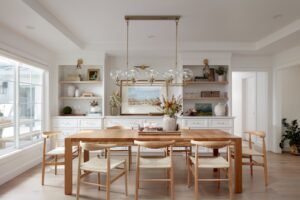 A bright and modern kitchen featuring a beautiful wooden dining table.