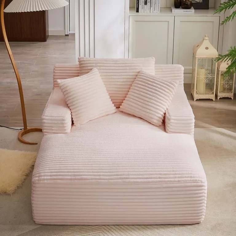 A bulky chair blocks a closet door in a cramped bedroom setting.