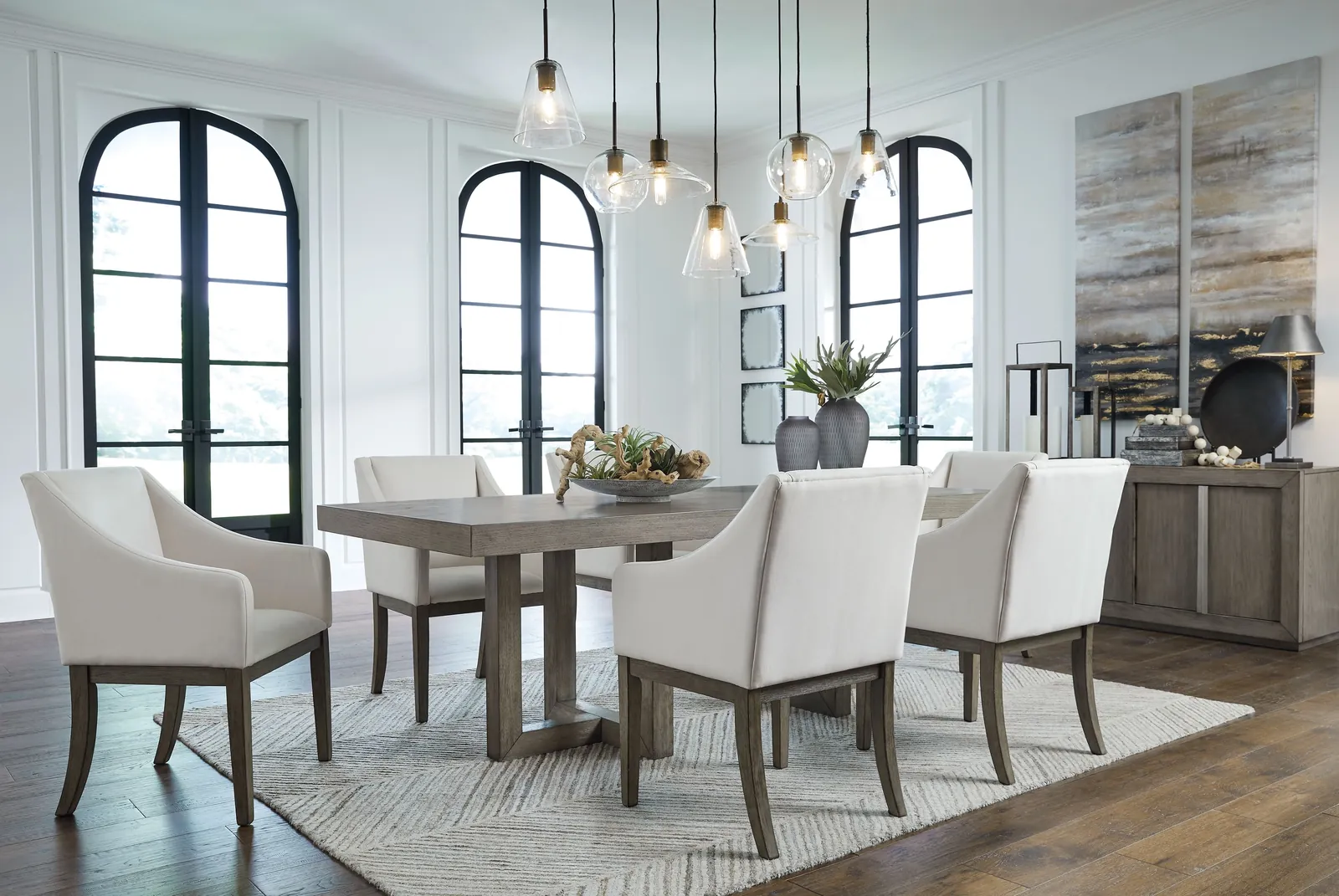 Carefully wrapping a wooden dining room table in protective blankets before storing it.
