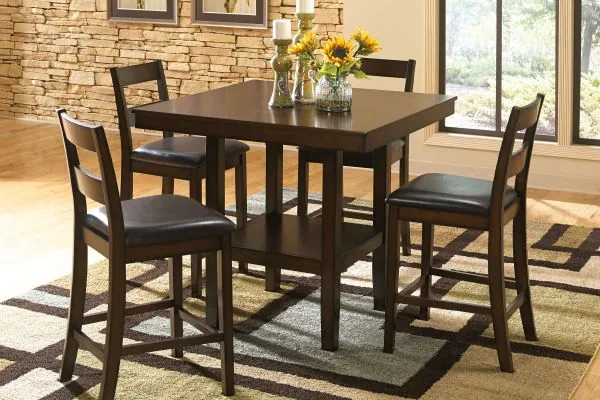 Checking a stored dining room table to ensure it remains in good condition.
