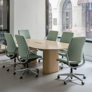 Choosing between ergonomic task chairs and stackable chairs for a small conference room.