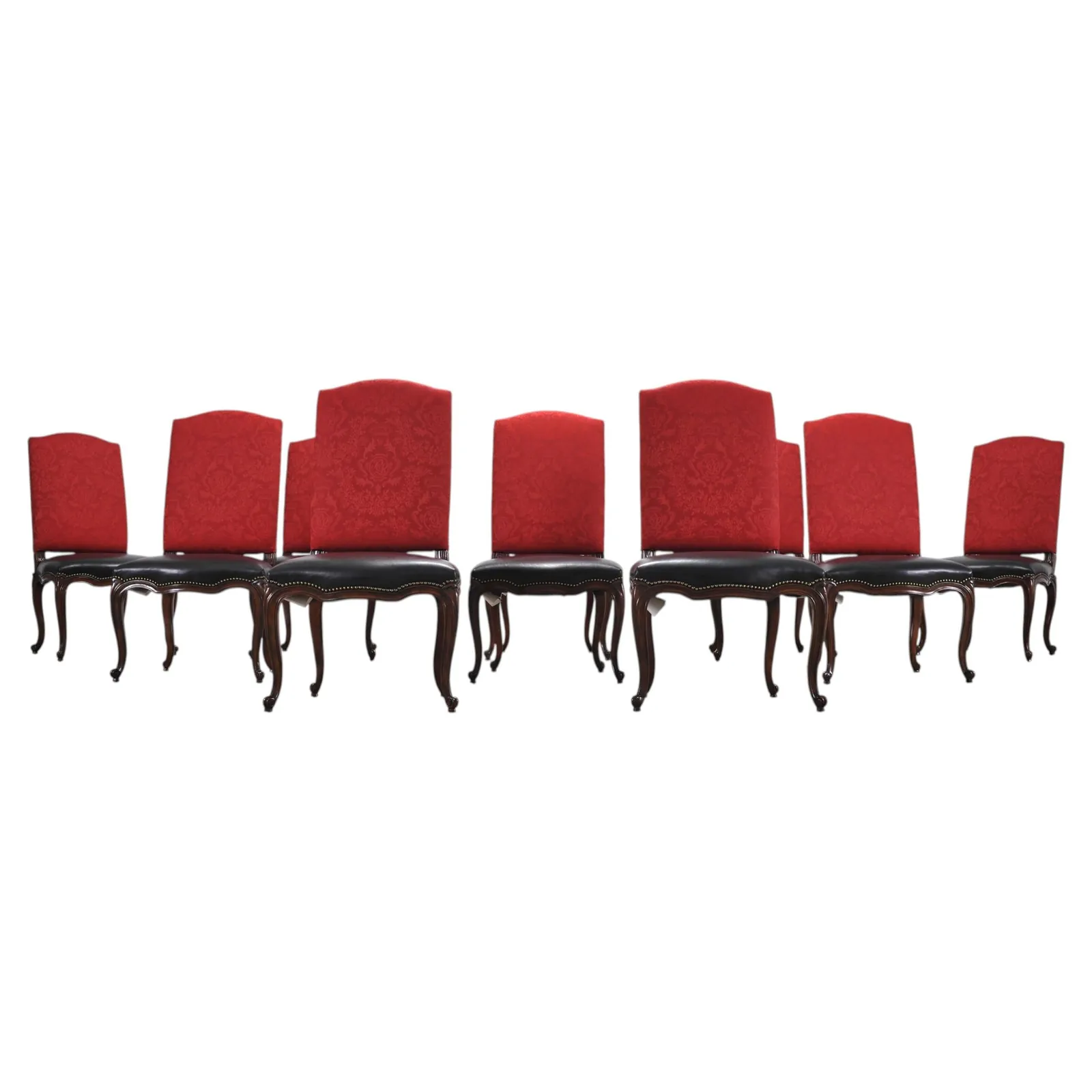 A classic wooden captain's chair with armrests at a dining table.