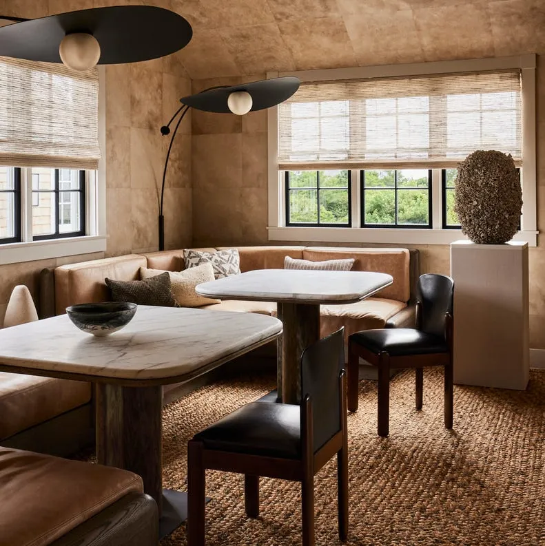 Compact furniture pieces like stackable chairs and folding tables help seat people in small spaces.