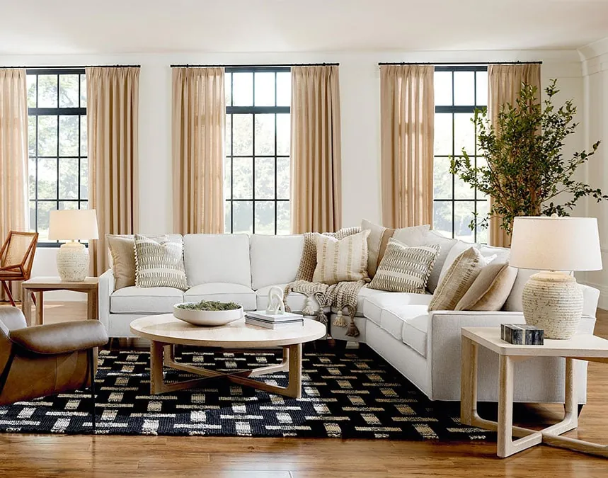 A compact living room with a minimalist sofa and plenty of open floor space.