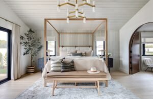 A cozy bedroom nook with an armchair and side table creating a relaxing space.