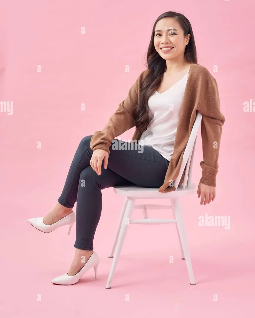 Creative alternative ways to sit on a chair for a professional portrait.
