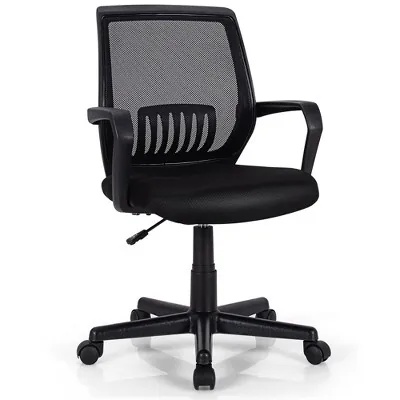 A customer inspects the features of an office chair in a furniture showroom.