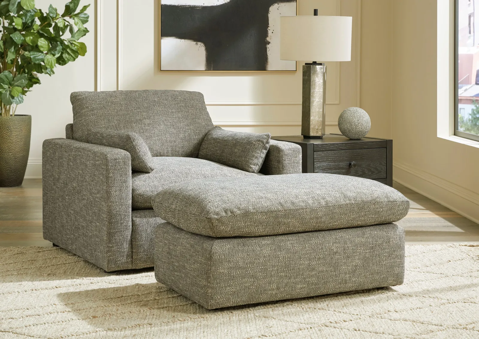 A detailed close-up of a plush overstuffed armchair with thick, soft cushions.