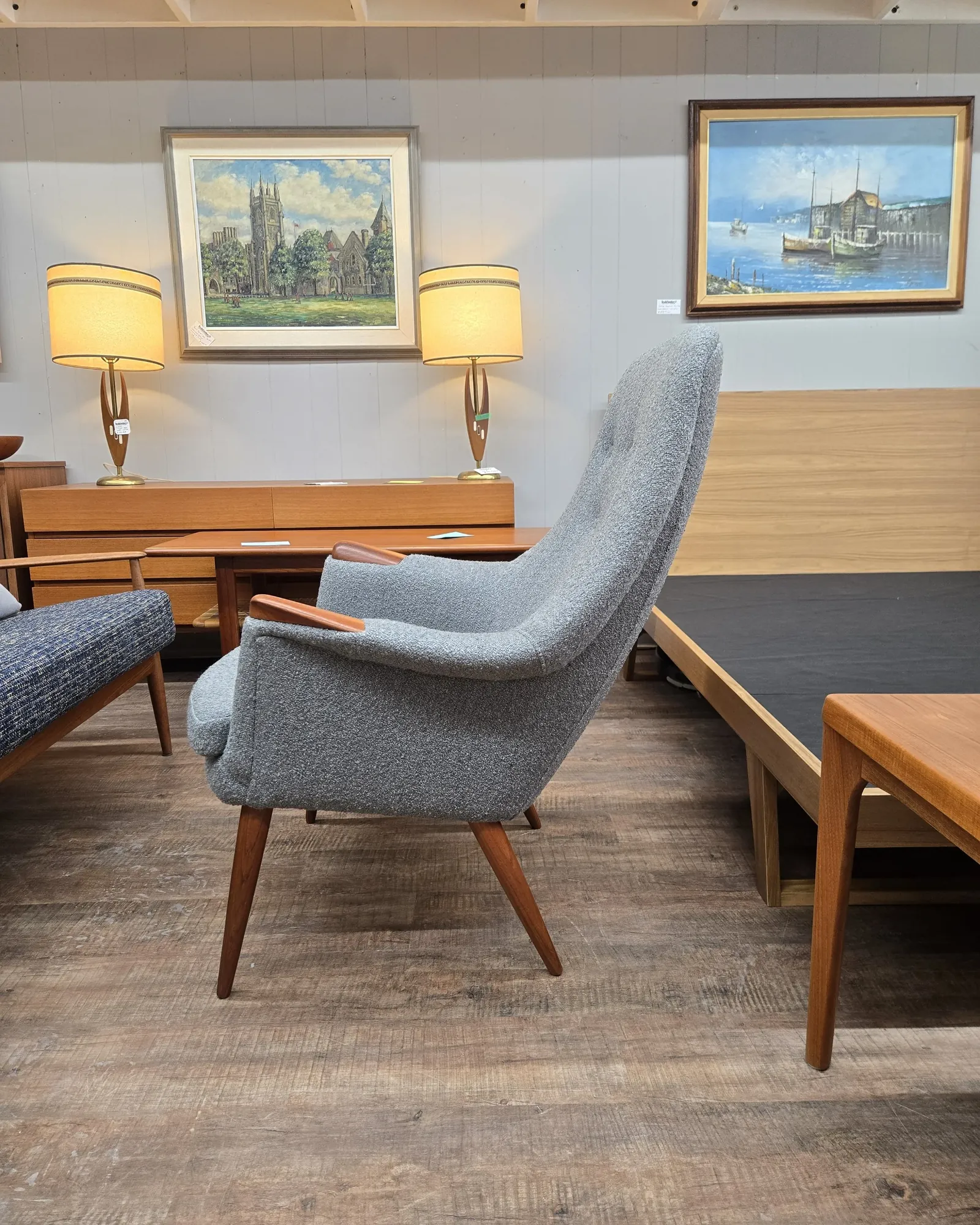 An Eames style lounge chair sits elegantly in a bright, modern living room.