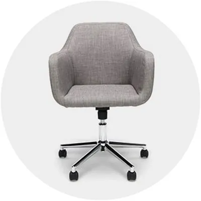 Four affordable desk chairs lined up side by side on a concrete floor.