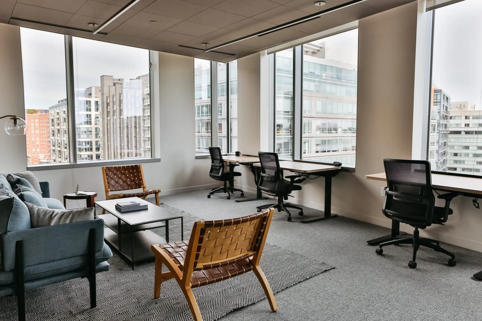 A heavy-duty desk chair placed in a shared open-plan office environment.