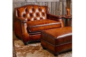 An inviting overstuffed armchair sits in a bright, modern living room space.