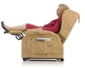 Modern beige sleeper chair shown as both seat and bed in bright room