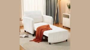 A modern chair bed displayed in a minimalist living room setting.