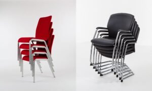 A modern conference room setup featuring comfortable ergonomic chairs and a sleek table.