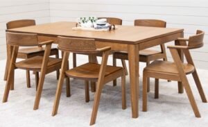 A modern dining room featuring a high-quality wooden table and stylish chairs.