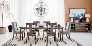 A modern dining room table serves as the centerpiece for this well-proportioned space.