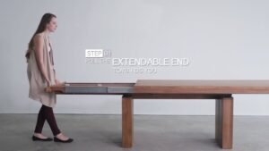 A modern dining table set in a bright room, showcasing how to open a dining table.
