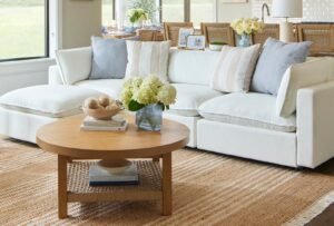 A modern living room comparing a sectional sofa and a standard sofa interior.