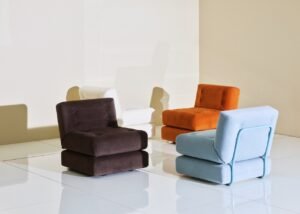 A modern living room featuring a stylish sofa bed that maximizes floor space.