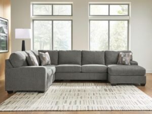 A modern living room showcasing a sofa and sectional for furniture comparison.