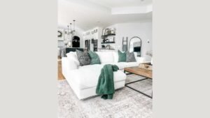 A modern modular sectional couch arranged in a spacious, light-filled living room.