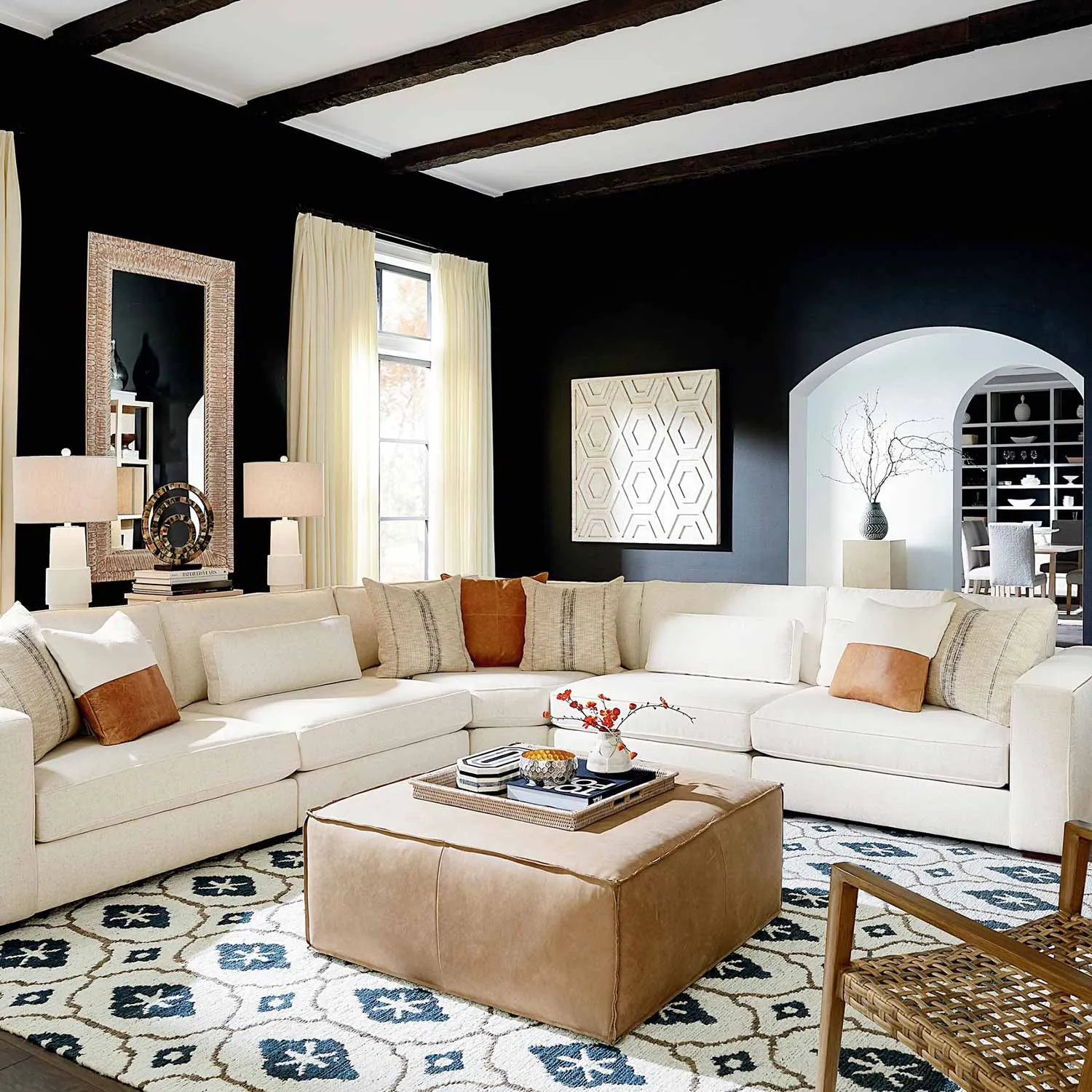 A modular sectional couch arranged in an L-shape within a modern living room.