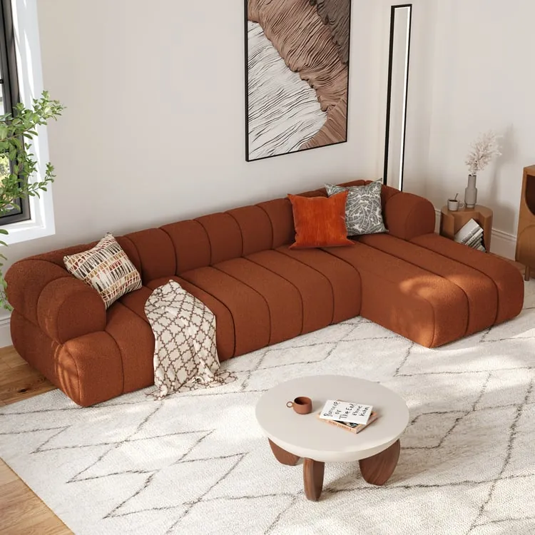A modular sectional piece being moved carefully through a narrow interior doorway.