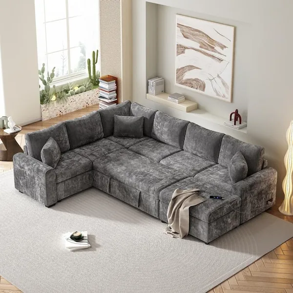 A person detaches a modular sectional sofa to make it easier to move.