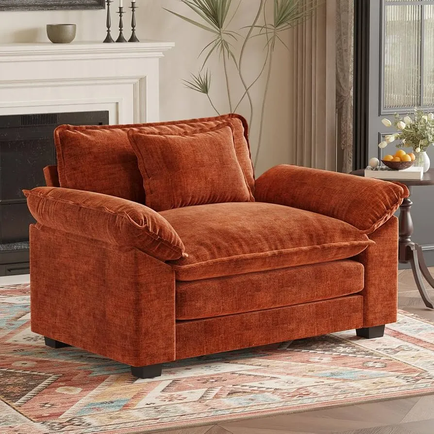 A person measuring an overstuffed chair to see if it fits through a doorway.