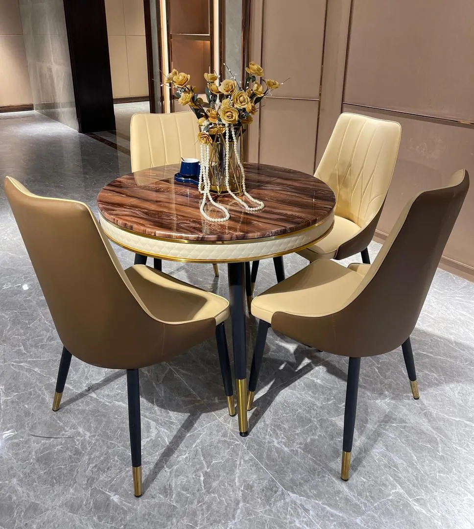 A person measuring the space around a dining table set to ensure proper clearance.