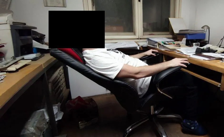 Person napping safely in a fully reclined computer chair with elevated legs