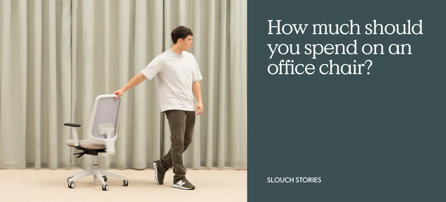 Person sitting correctly in an ergonomic office chair at a minimalist desk.