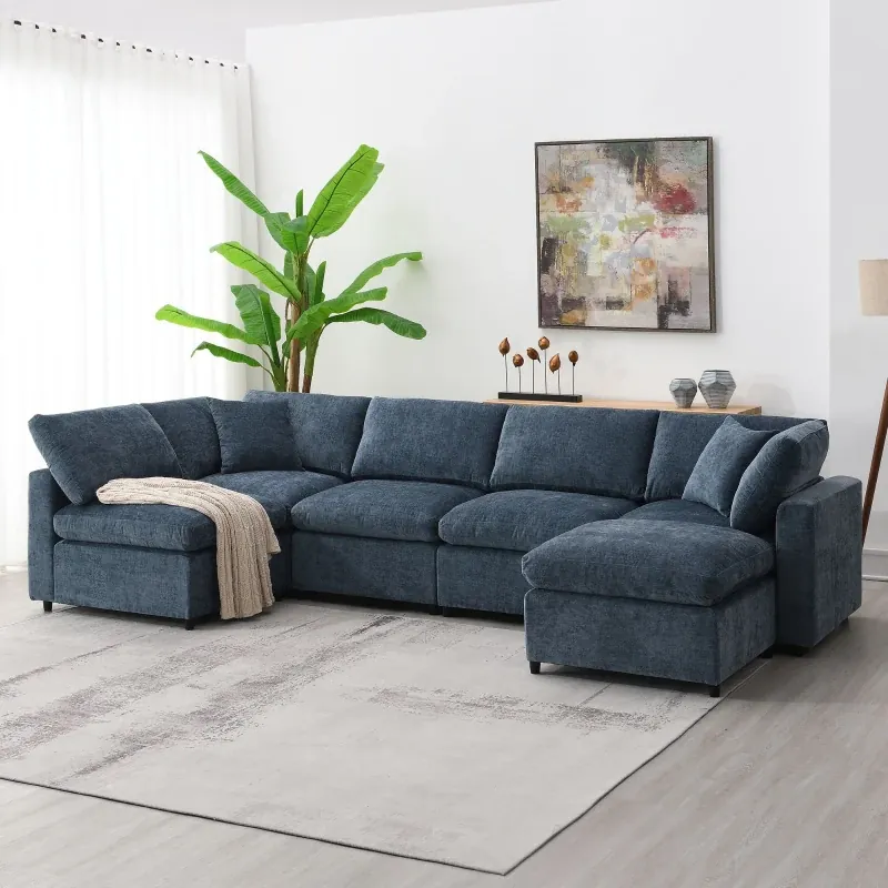A person testing the comfort and seat depth of a new living room sofa.